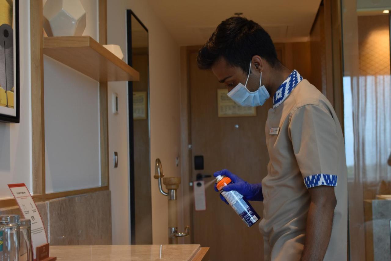 Welcomhotel By Itc Hotels, Racecourse, Coimbatore Exterior photo A hotel employee disinfecting a guest room